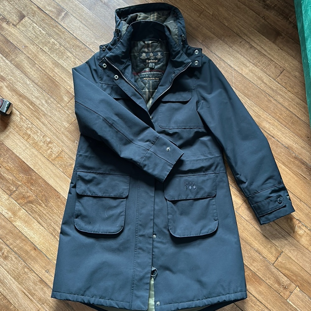 Barbour women’s rain coat with Barbour tartan lining. Size US 8